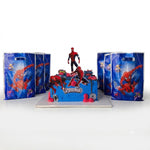 Spider-Man themed party decoration set featuring a decorated blue cake with Spider-Man figures, spider man gift bags only at Cake Gurus Ruaka. Delivery within Nairobi