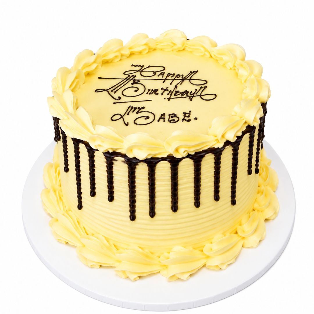 A round birthday cake with pale yellow frosting, piped rosettes around the top and sides, dark chocolate drip decorations, and the message 'Happy Birthday to me, ABE.' written in black icing on top, shown on a white plate against a white background. 0.5kg decorated carrot orange cake from Cake Gurus Ruaka