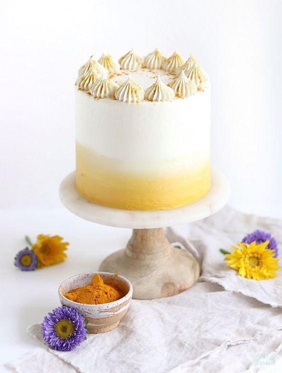 A frosted lemon cake with white and yellow layers, topped with lemon zest ,  as a sweet treat by Cake Gurus Ruaka Nairobi with deliveries in Nairobi and its environs. Same day delivery available