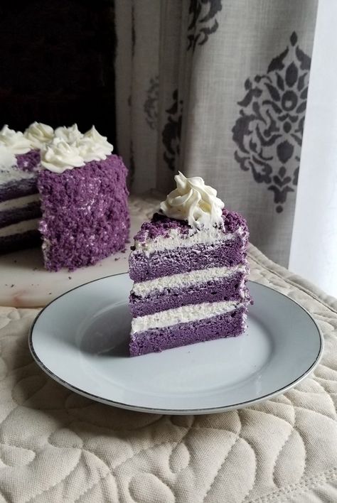 A slice of red velvet cake with white frosting on a plate,  as a sweet treat by Cake Gurus Ruaka Nairobi with deliveries in Nairobi and its environs.