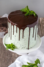 Choco Mint cake with dense chocolate layers and a minty green frosting, topped with a chocolate drip and fresh mint leaves  as a sweet treat by Cake Gurus Ruaka Nairobi with deliveries in Nairobi and its environs.