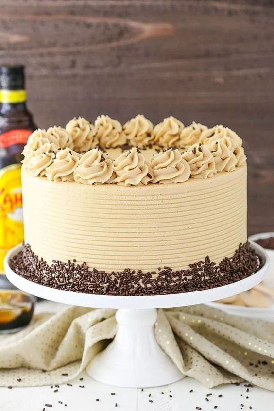 choco Chip cake with chocolate chips and beige frosting  as a sweet treat by Cake Gurus Ruaka Nairobi with deliveries in Nairobi and its environs
